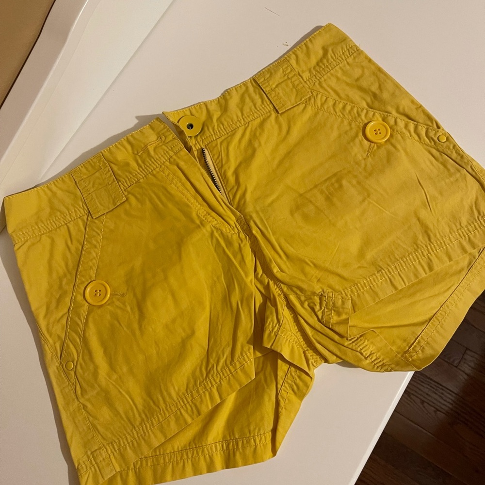 2 pair of shorts. Yellow and white shorts.